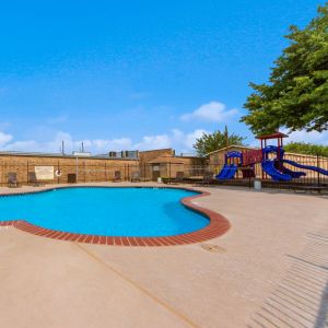 Living Oaks Apartments in Red Oak, TX with sparkling community pool and sun deck